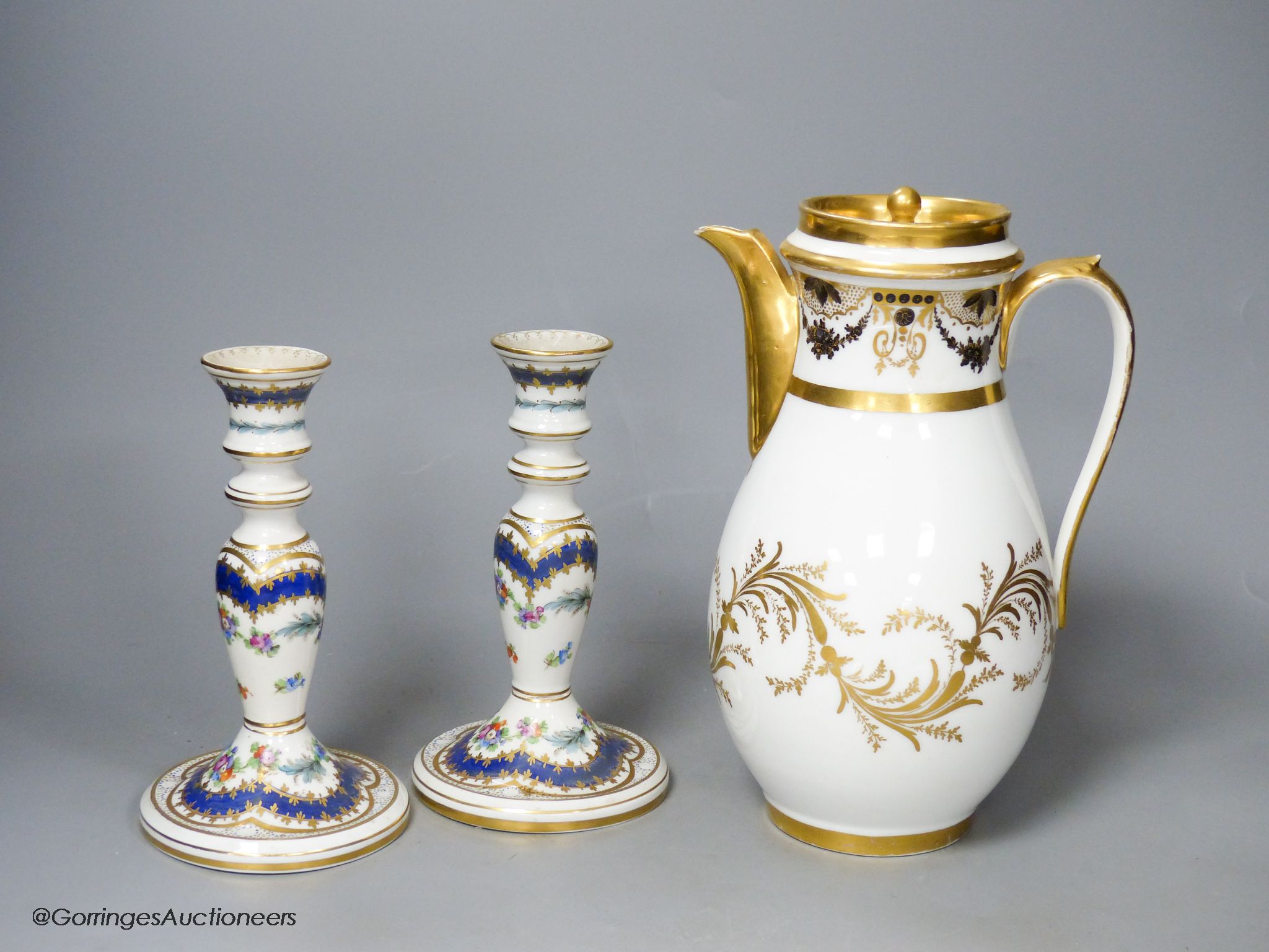 A 19th century Paris porcelain coffee pot and a pair of Dresden candlesticks, tallest 24cm